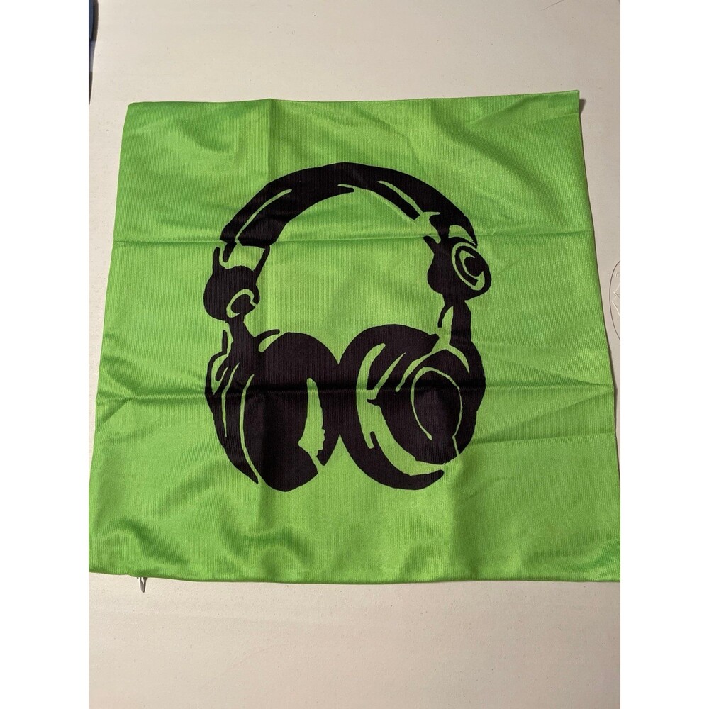 Green pillowcase with black headphones graphic